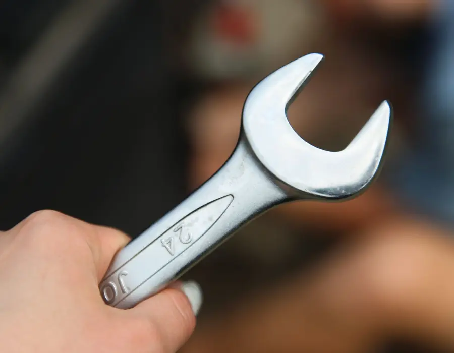 A spanner on a work surface